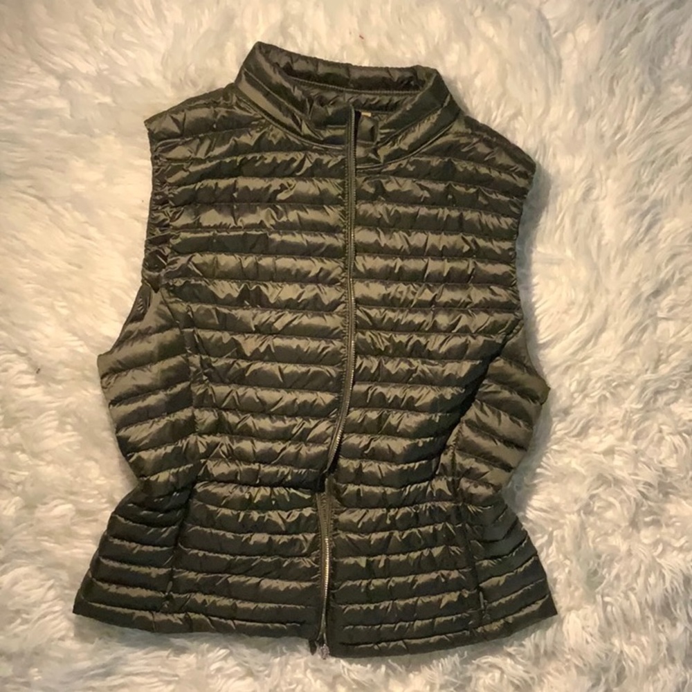 Dirty green colored puffy vest